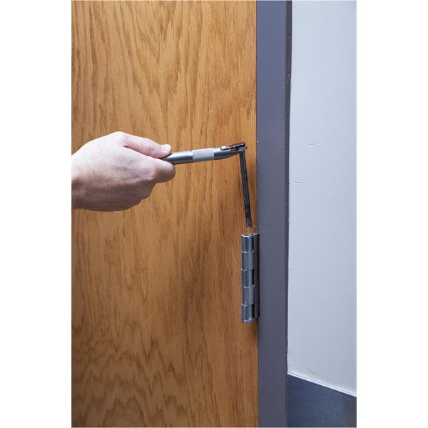 Person using a MARSHALLTOWN door pin removal tool on a door hinge