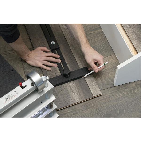 Person using a BULLET TOOLS stair step scribe on wood flooring