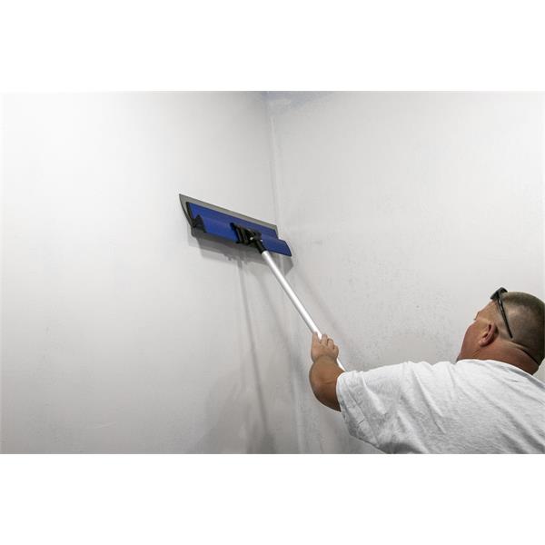 Person using MARSHALLTOWN ProSkim™ Handle to smooth a wall surface