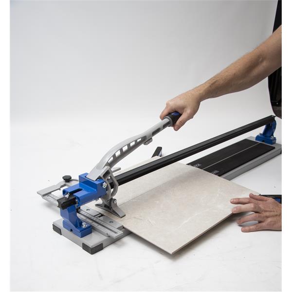 Person cutting tile with a MARSHALLTOWN 36" tile cutter