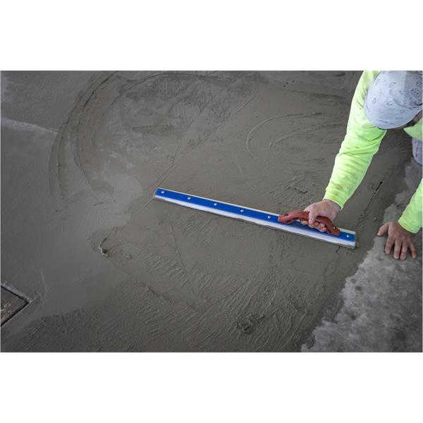 Person using MARSHALLTOWN White Lightning™ Tapered Darby on wet concrete flooring