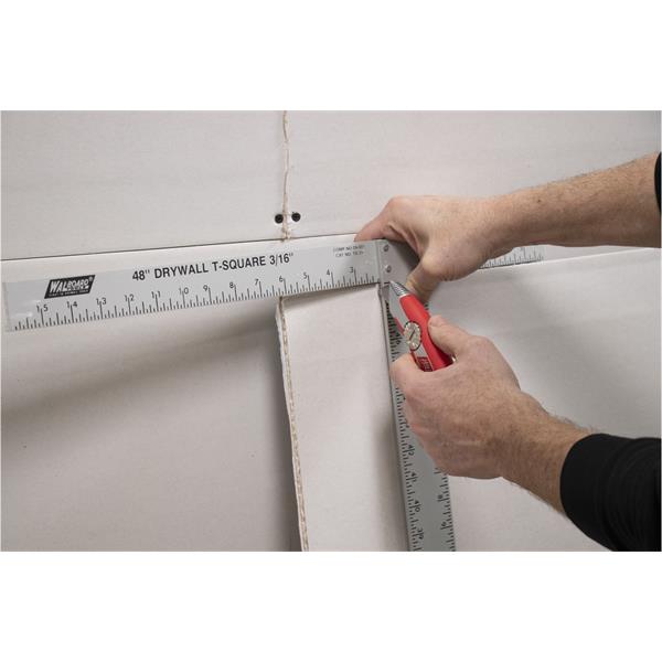 Person using a WAL-BOARD TOOLS comfort fixed blade utility knife on drywall