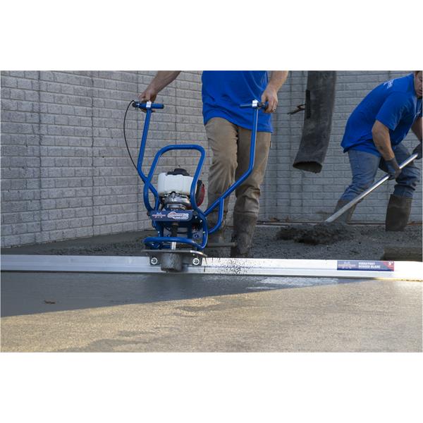 Person operating a MARSHALLTOWN Power Screed Shockwave™ 2.0 on wet concrete