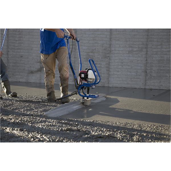 Person using MARSHALLTOWN Power Screed on wet concrete surface