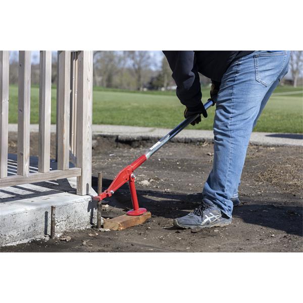 Person using a MARSHALLTOWN QLT stake puller on a construction site