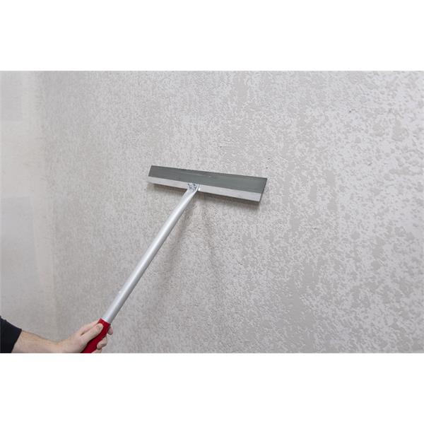 Hand using a WAL-BOARD TOOLS lightweight knockdown knife on a wall surface