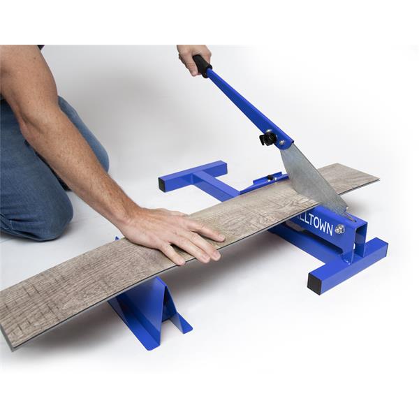 Person using a MARSHALLTOWN flooring cross-cutter on a wooden plank