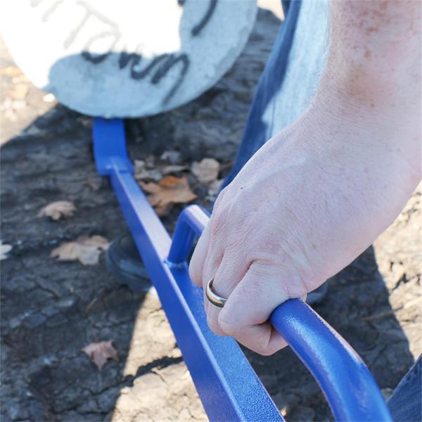 Close-up of a person using a MARSHALLTOWN handled monster pry bar outdoors