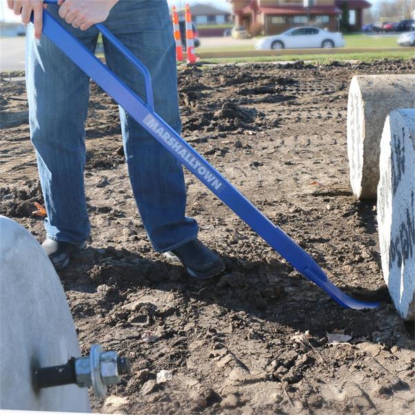 Worker using a MARSHALLTOWN handled monster pry bar on construction site