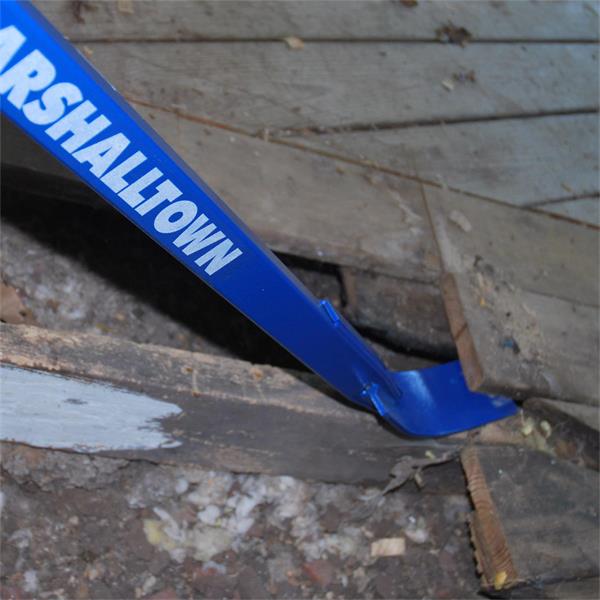 Top view of a MARSHALLTOWN Little Monster Pry Bar being used to lift wooden floorboards.