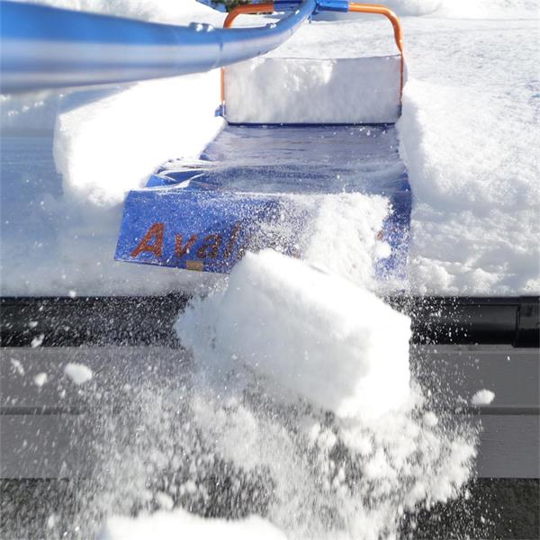 AVALANCHE snow removal tool in action clearing rooftop snow