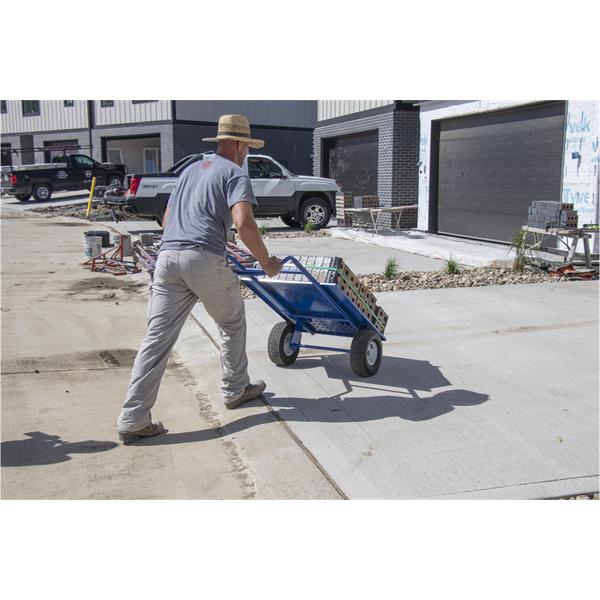 Person transporting bricks with a MARSHALLTOWN brick & block cart