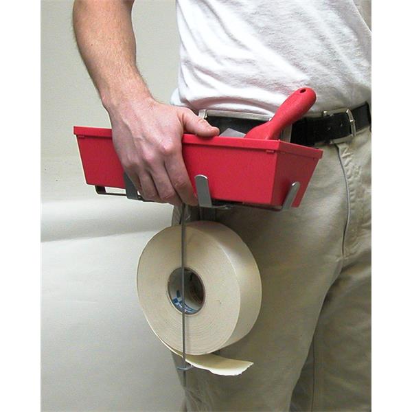 Person holding a MARSHALLTOWN QLT mud pan & tape holder