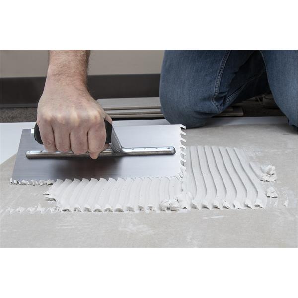 Applying material with a MARSHALLTOWN LayFlat™ Notched Trowel