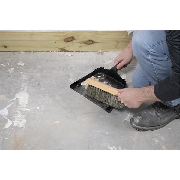 Man using a MARSHALLTOWN dust pan set to clean debris from the floor