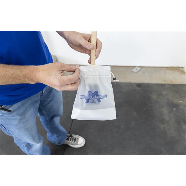 Person holding a MARSHALLTOWN Paint Brush Saver bag