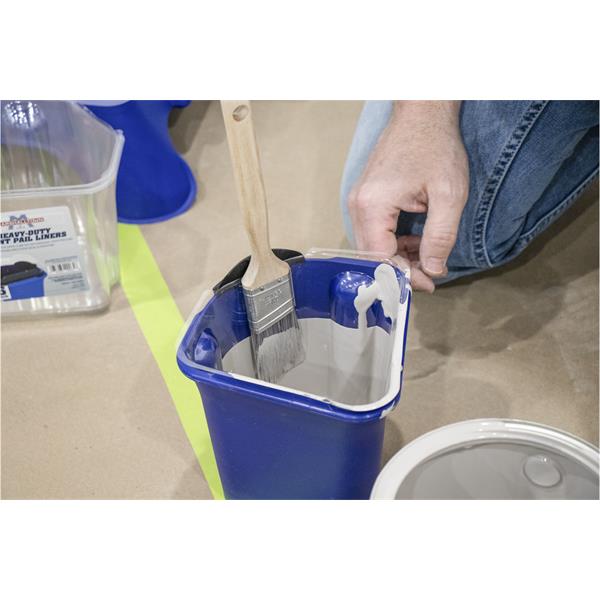 Person using MARSHALLTOWN heavy-duty paint pail with brush