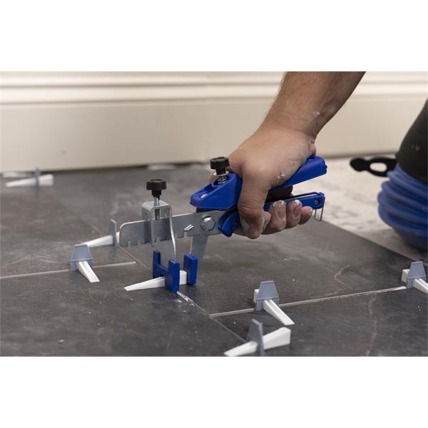 Person using a BARWALT PLS™ Tile Leveling System on floor tiles