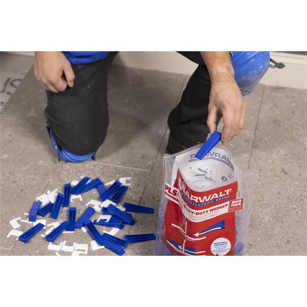 Person using BARWALT PLS Max™ Tile Leveling System on floor tiles