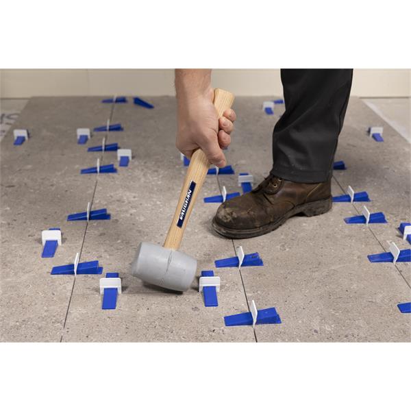 Person using BARWALT PLS Max™ Tile Leveling System on floor tiles